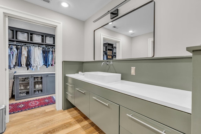 55 E Main St # 208, Chattanooga, TN 37408 - bathroom featuring vanity, wood finished floors, and a walk in closet