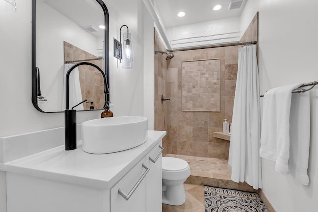 55 E Main St # 208, Chattanooga, TN 37408 - bathroom featuring vanity, toilet, tiled shower, recessed lighting, and tile patterned floors