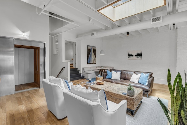 55 E Main St # 208, Chattanooga, TN 37408 - living area with hardwood / wood-style flooring and stairs