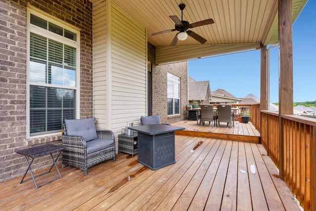1607 Edgewater Ln, Clarksville, TN 37043 - wooden deck featuring outdoor dining space, ceiling fan, and outdoor lounge area