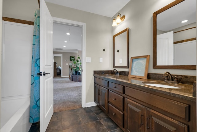 1607 Edgewater Ln, Clarksville, TN 37043 - bathroom featuring double vanity, baseboards, and recessed lighting