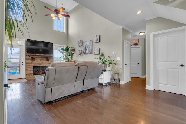 1607 Edgewater Ln, Clarksville, TN 37043 - living room featuring ceiling fan, a stone fireplace, dark wood-type flooring, baseboards, and crown molding