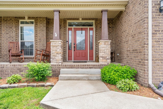 1607 Edgewater Ln, Clarksville, TN 37043 - view of exterior entry featuring brick siding and a porch