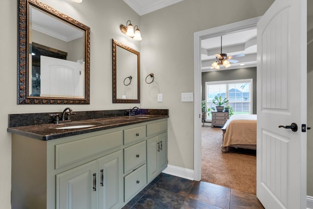 1607 Edgewater Ln, Clarksville, TN 37043 - ensuite bathroom featuring crown molding, double vanity, baseboards, and a ceiling fan