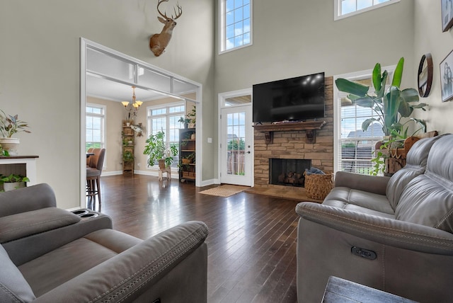 1607 Edgewater Ln, Clarksville, TN 37043 - living room featuring a chandelier, healthy amount of natural light, hardwood / wood-style floors, and a high ceiling