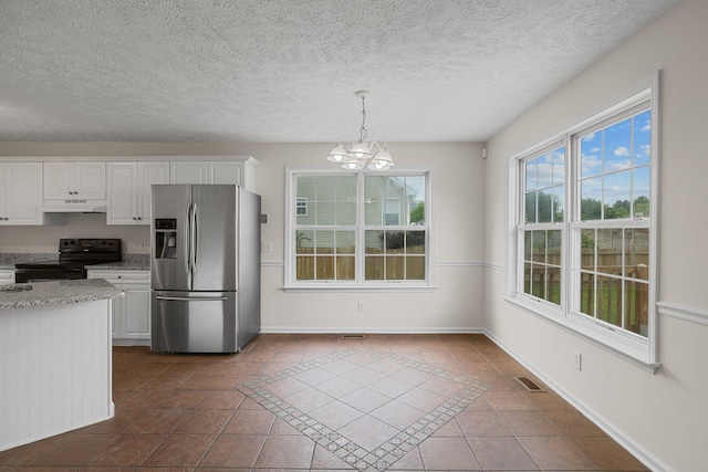 1332 Dodd Trl, Murfreesboro, TN 37128 - kitchen with stainless steel fridge with ice dispenser, black electric range, a chandelier, dark tile patterned floors, and white cabinetry