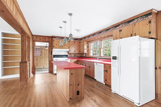 411 Tremont Dr, Murfreesboro, TN 37130 - kitchen with white appliances, a sink, under cabinet range hood, light wood-style floors, and wood walls
