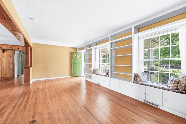 411 Tremont Dr, Murfreesboro, TN 37130 - unfurnished room with light wood finished floors, baseboards, and wooden walls