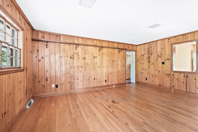 411 Tremont Dr, Murfreesboro, TN 37130 - unfurnished room with light wood-style flooring, wooden walls, ornamental molding, and baseboards