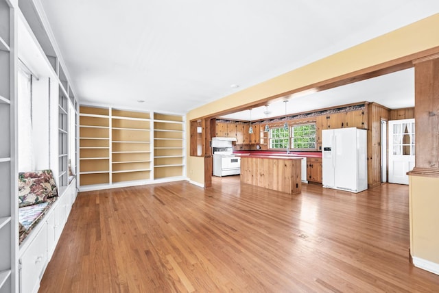 411 Tremont Dr, Murfreesboro, TN 37130 - kitchen featuring white appliances, light wood-style flooring, a center island, built in shelves, and open floor plan