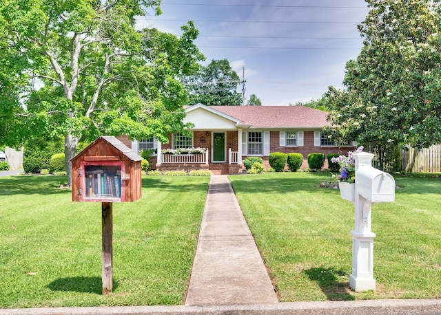 411 Tremont Dr, Murfreesboro, TN 37130 - ranch-style house with a porch, brick siding, a front lawn, and a shingled roof