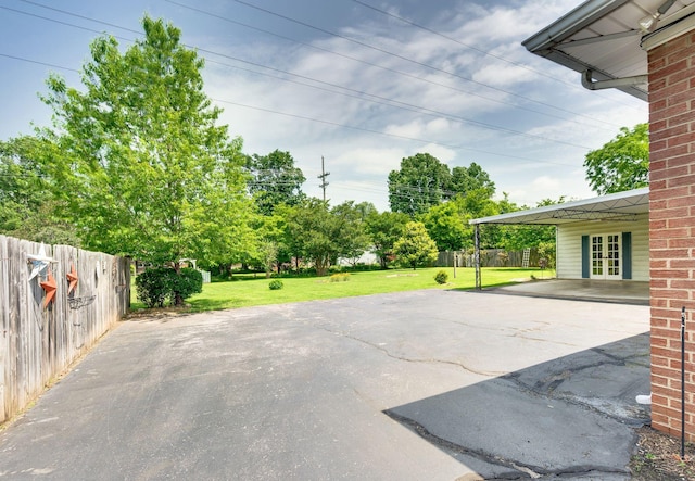 411 Tremont Dr, Murfreesboro, TN 37130 - view of patio / terrace with driveway, french doors, and an attached carport