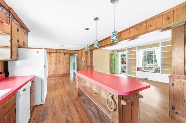 411 Tremont Dr, Murfreesboro, TN 37130 - kitchen featuring white appliances, light wood-style floors, wood walls, pendant lighting, and a kitchen island