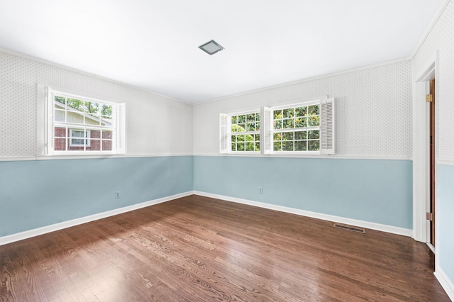 411 Tremont Dr, Murfreesboro, TN 37130 - spare room with wood finished floors, wallpapered walls, ornamental molding, and baseboards