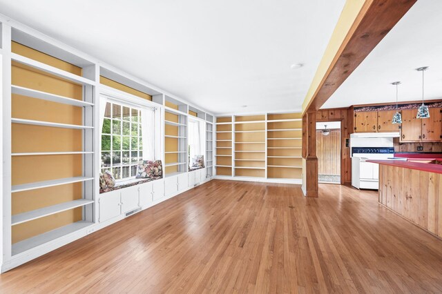 411 Tremont Dr, Murfreesboro, TN 37130 - unfurnished living room with light wood finished floors, built in shelves, and wooden walls
