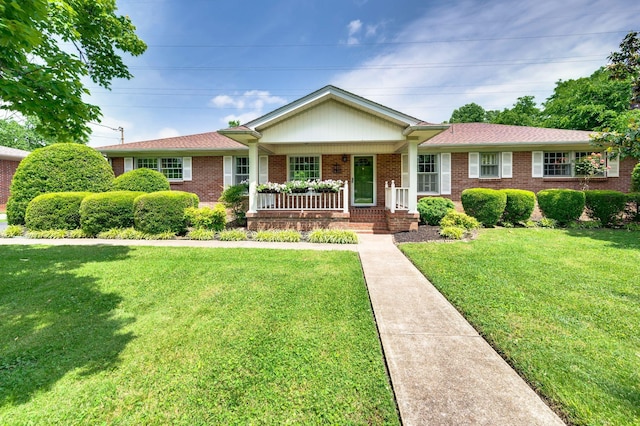 411 Tremont Dr, Murfreesboro, TN 37130 - ranch-style house with covered porch, brick siding, and a front lawn