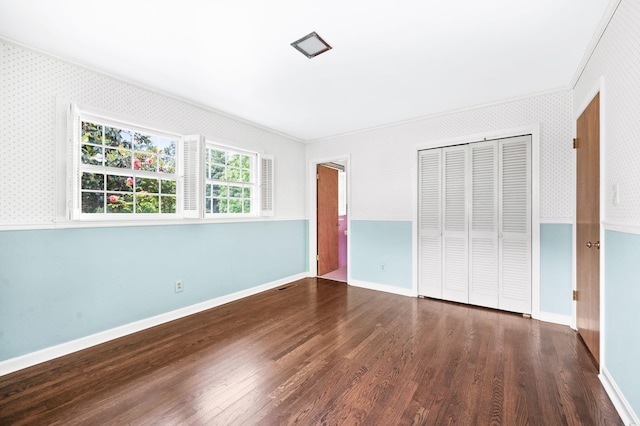 411 Tremont Dr, Murfreesboro, TN 37130 - unfurnished bedroom featuring ornamental molding, wood finished floors, a closet, wallpapered walls, and baseboards