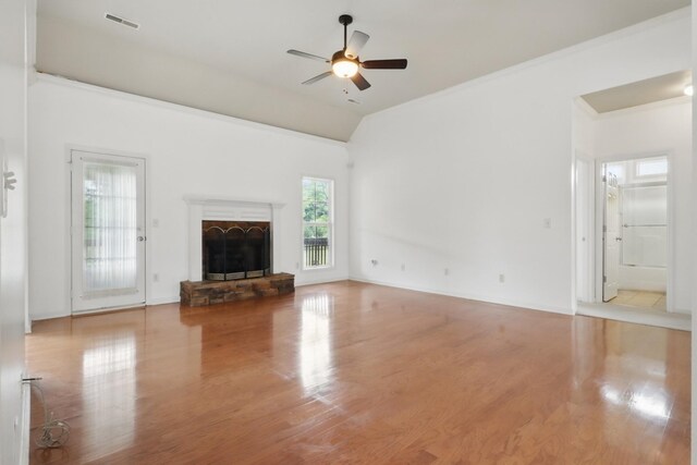 208 Sunnyside Dr, Chapel Hill, TN 37034 - unfurnished living room featuring a ceiling fan, wood finished floors, a fireplace with raised hearth, vaulted ceiling, and ornamental molding