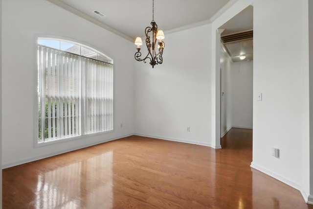 208 Sunnyside Dr, Chapel Hill, TN 37034 - spare room with plenty of natural light, wood finished floors, ornamental molding, baseboards, and a chandelier