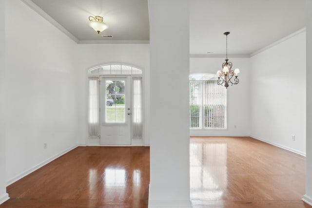 208 Sunnyside Dr, Chapel Hill, TN 37034 - foyer with ornamental molding, wood finished floors, a chandelier, and baseboards