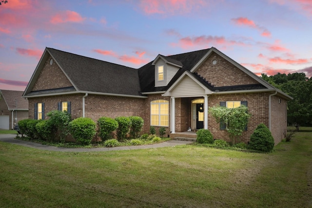 208 Sunnyside Dr, Chapel Hill, TN 37034 - traditional-style house featuring brick siding, a front yard, and roof with shingles