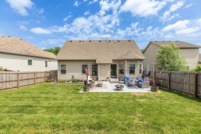 rear view of property featuring an outdoor living space with a fire pit and a patio