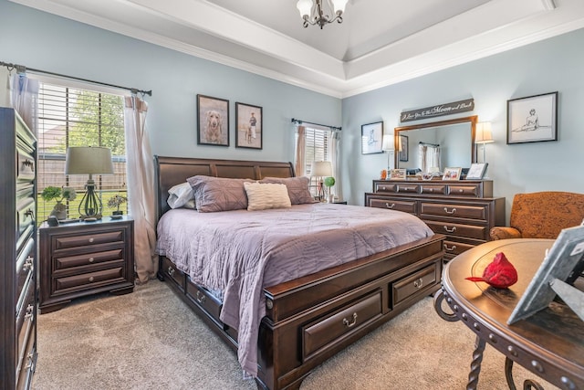 bedroom featuring carpet, multiple windows, a chandelier, crown molding, and a raised ceiling