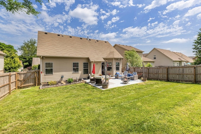 back of property with outdoor lounge area, a patio, and a shingled roof