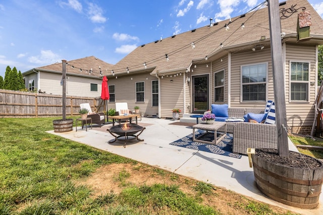 view of patio with an outdoor living space with a fire pit