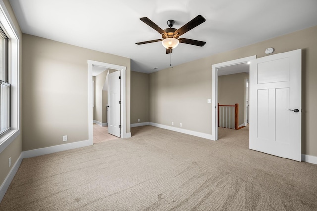 11731 Milton St, Milton, TN 37118 - unfurnished bedroom with light colored carpet, baseboards, and a ceiling fan