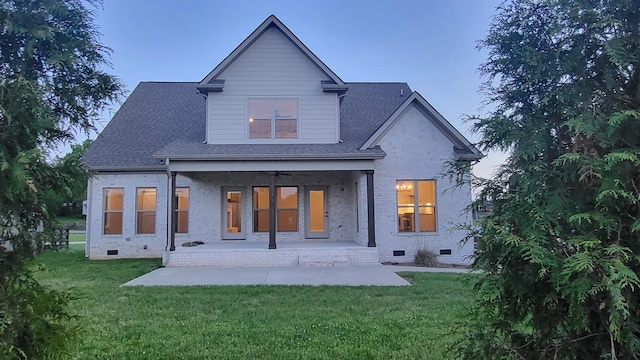 11731 Milton St, Milton, TN 37118 - back of house at dusk featuring crawl space, brick siding, and a yard