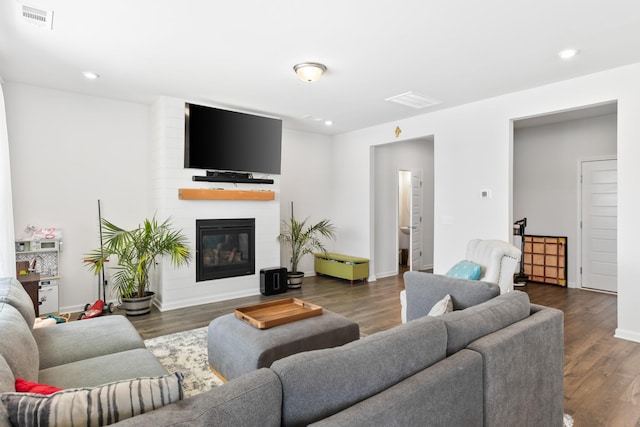 1080 Laurel Valley Ln, Mount Juliet, TN 37122 - living room featuring recessed lighting, a large fireplace, dark wood-style floors, and baseboards