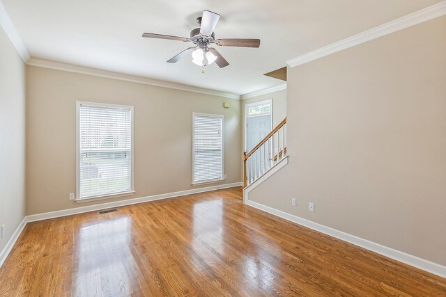 201 Dakota Dr, Spring Hill, TN 37174 - spare room with stairs, crown molding, baseboards, wood finished floors, and a ceiling fan