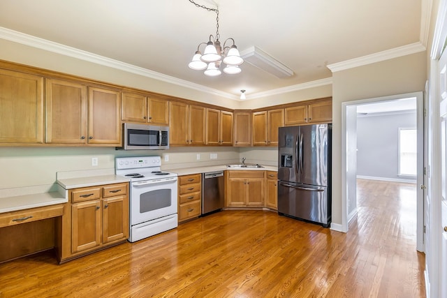 201 Dakota Dr, Spring Hill, TN 37174 - kitchen featuring stainless steel appliances, a sink, a chandelier, crown molding, and light countertops