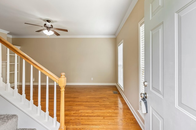 201 Dakota Dr, Spring Hill, TN 37174 - foyer entrance featuring ornamental molding, light wood-type flooring, a ceiling fan, stairway, and baseboards