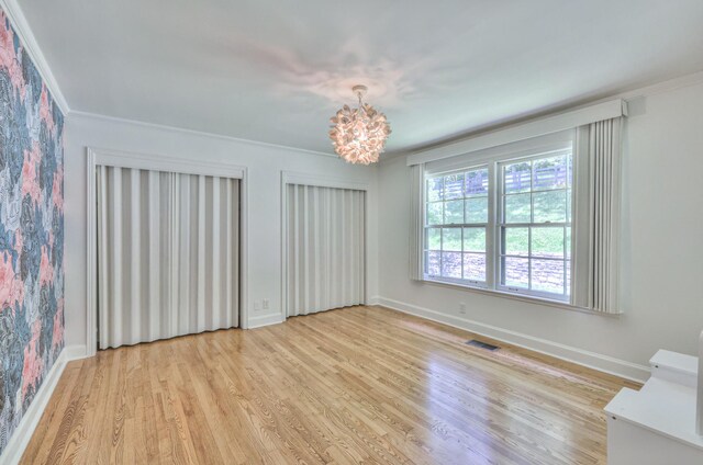 1702 Old Hickory Blvd, Brentwood, TN 37027 - unfurnished room featuring light wood-style flooring, a chandelier, and crown molding