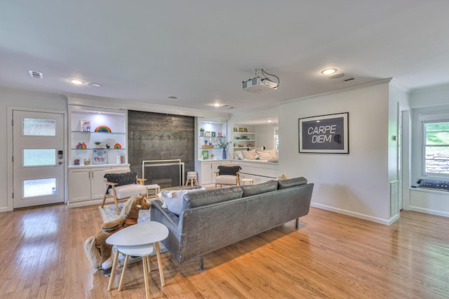 1702 Old Hickory Blvd, Brentwood, TN 37027 - living area featuring a large fireplace, crown molding, light wood-style flooring, built in features, and recessed lighting