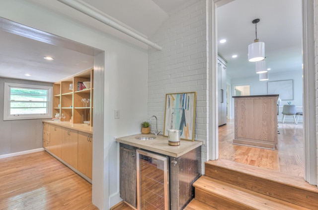 1702 Old Hickory Blvd, Brentwood, TN 37027 - indoor bar with beverage cooler, light wood-style floors, and pendant lighting