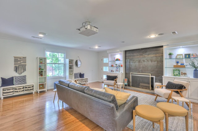 1702 Old Hickory Blvd, Brentwood, TN 37027 - living area featuring light wood-style floors, a fireplace, recessed lighting, and built in shelves