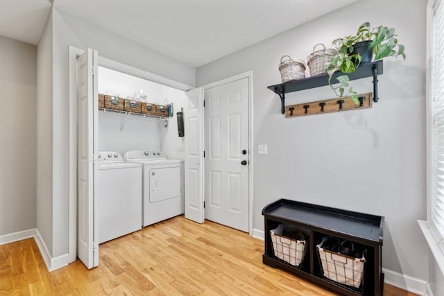 210 Highland Trl, Estill Springs, TN 37330 - laundry room with separate washer and dryer, light wood-style flooring, baseboards, and healthy amount of natural light