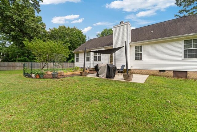 210 Highland Trl, Estill Springs, TN 37330 - back of property featuring a vegetable garden, crawl space, a patio, and a chimney