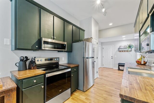 210 Highland Trl, Estill Springs, TN 37330 - kitchen featuring stainless steel appliances, green cabinets, wood counters, light wood-type flooring, and recessed lighting