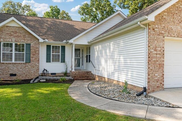 210 Highland Trl, Estill Springs, TN 37330 - entrance to property featuring an attached garage, crawl space, a lawn, and roof with shingles