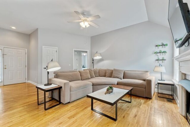 210 Highland Trl, Estill Springs, TN 37330 - living area with a ceiling fan, light wood finished floors, and baseboards