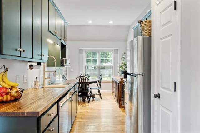 210 Highland Trl, Estill Springs, TN 37330 - kitchen with appliances with stainless steel finishes, a sink, wooden counters, light wood finished floors, and recessed lighting