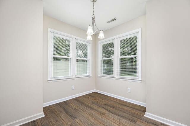 205 Blue Lake Dr, Tullahoma, TN 37388 - empty room with baseboards, a chandelier, and dark wood-type flooring