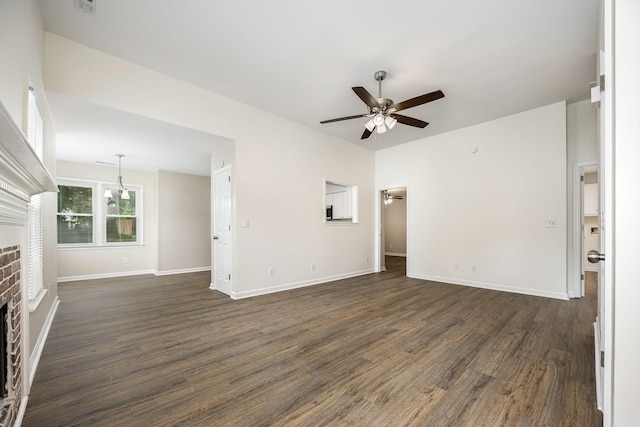 205 Blue Lake Dr, Tullahoma, TN 37388 - unfurnished living room with a ceiling fan, dark wood-type flooring, a fireplace, and baseboards