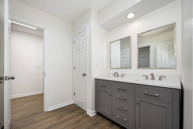 205 Blue Lake Dr, Tullahoma, TN 37388 - bathroom with wood finished floors, double vanity, and baseboards