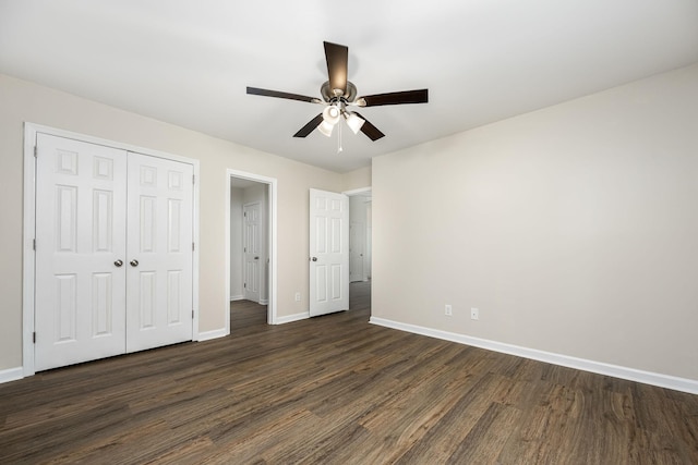 205 Blue Lake Dr, Tullahoma, TN 37388 - unfurnished bedroom with baseboards, dark wood finished floors, a closet, and a ceiling fan