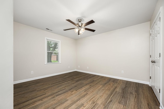 205 Blue Lake Dr, Tullahoma, TN 37388 - unfurnished room featuring dark wood-style floors, a ceiling fan, and baseboards